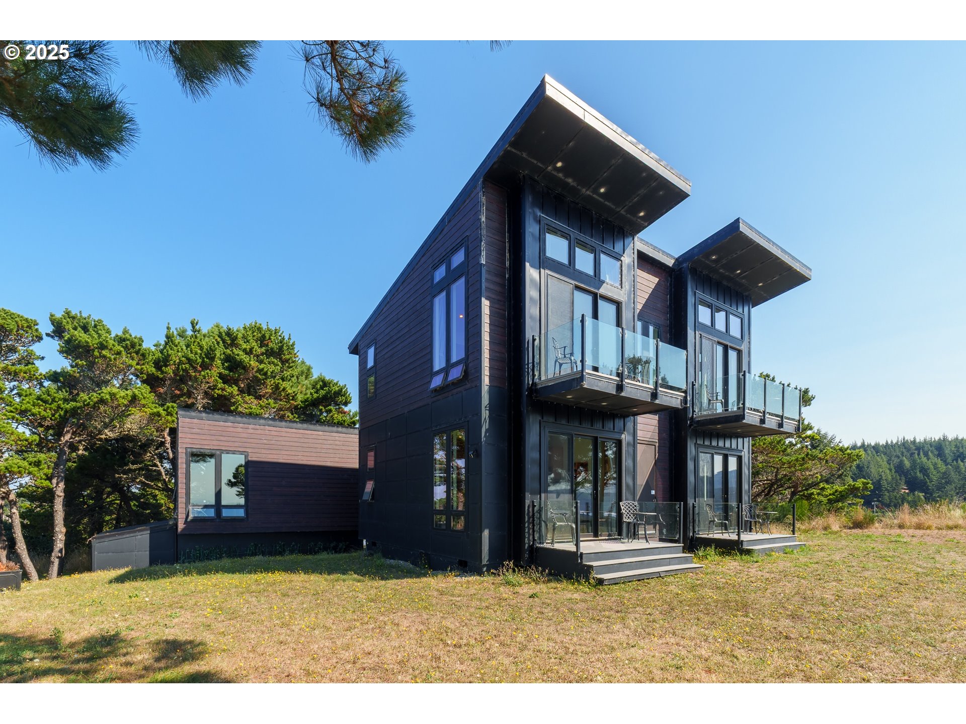 409 Jackson Street Port Orford, OR 97465 - Photo 2 of 48 a view of a house with a yard