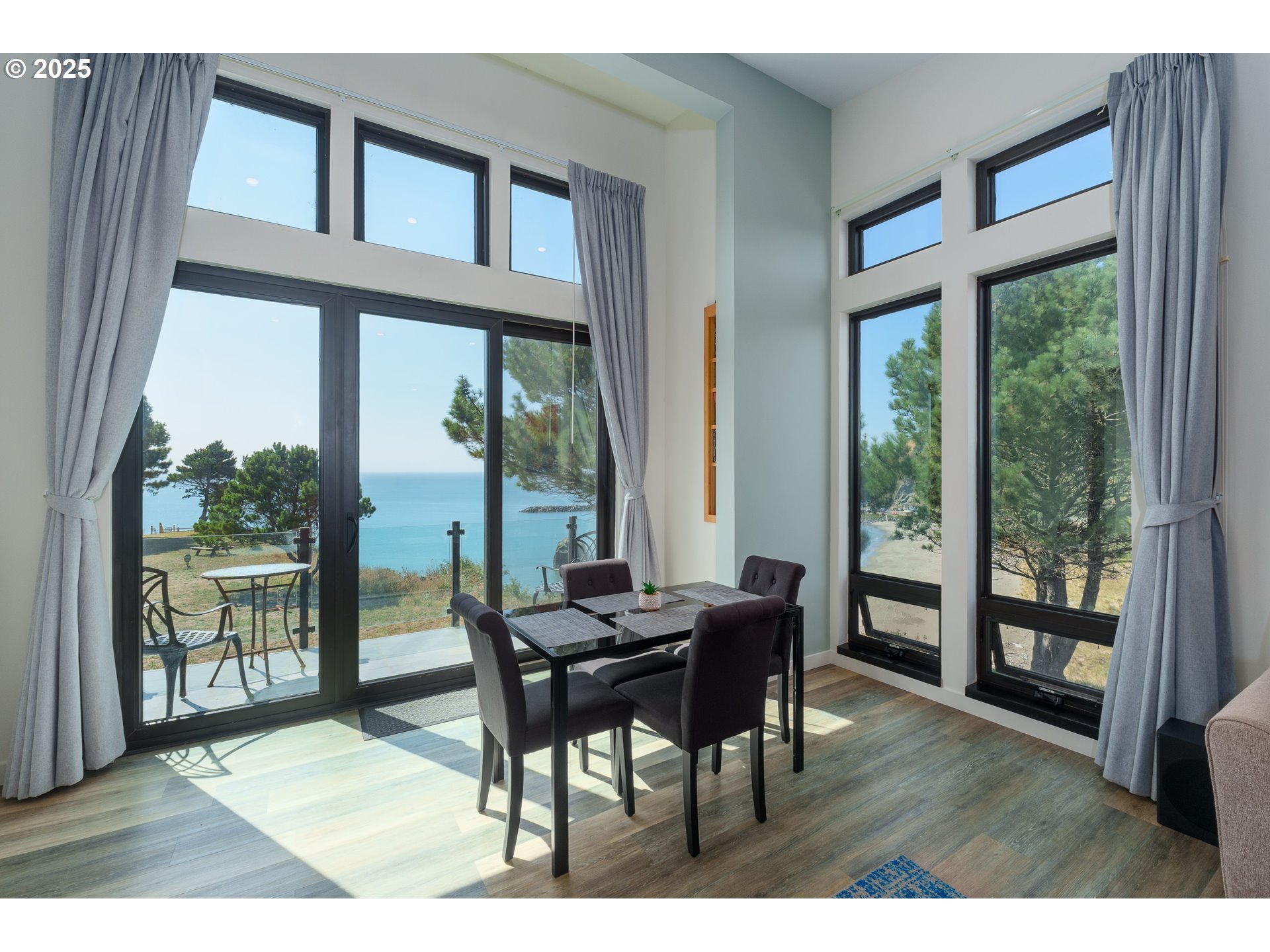 409 Jackson Street Port Orford, OR 97465 - Photo 22 of 48 a view of a dining room with furniture window and wooden floor