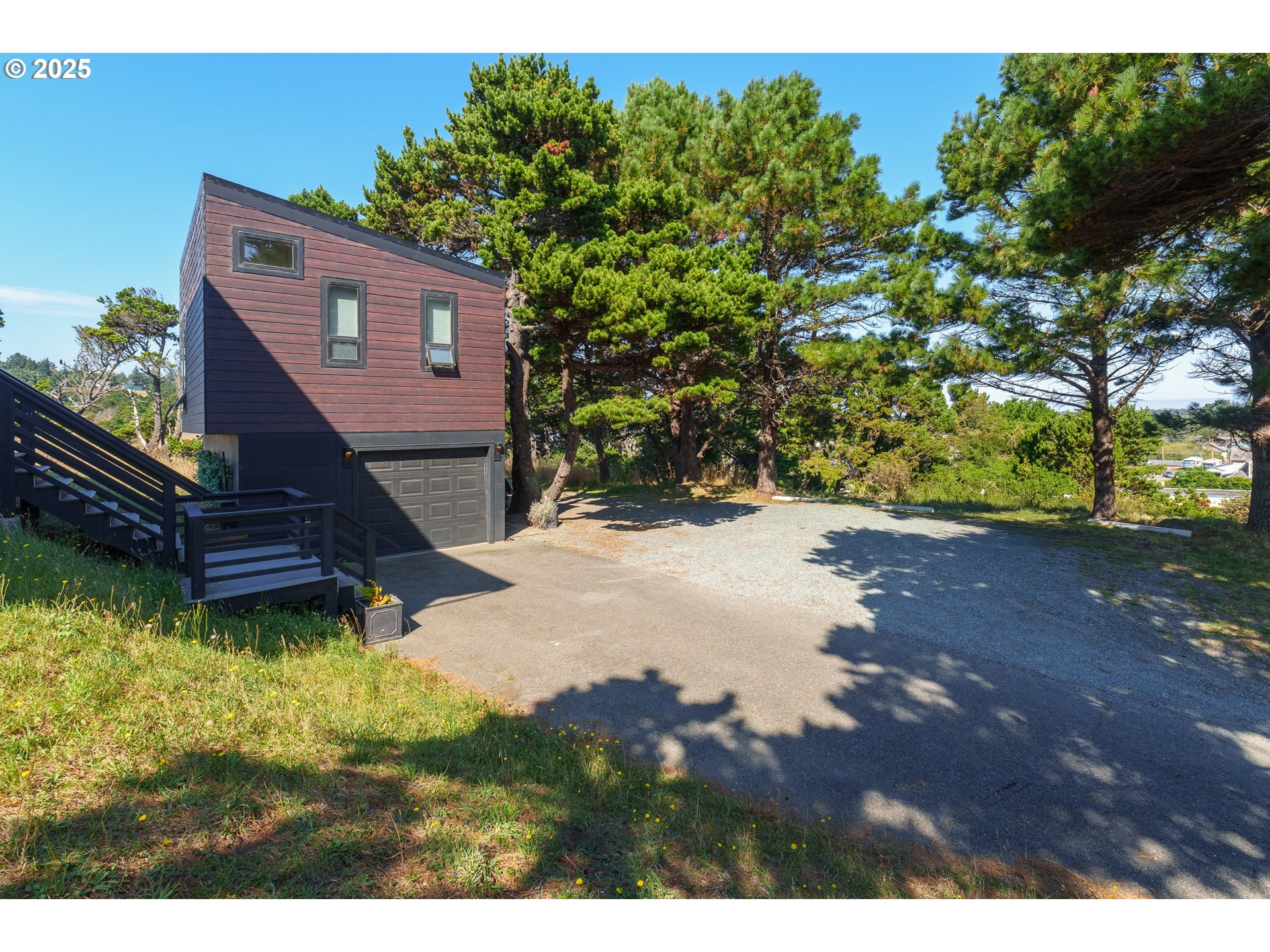 409 Jackson Street Port Orford, OR 97465 - Photo 39 of 48 a view of a back yard of the house