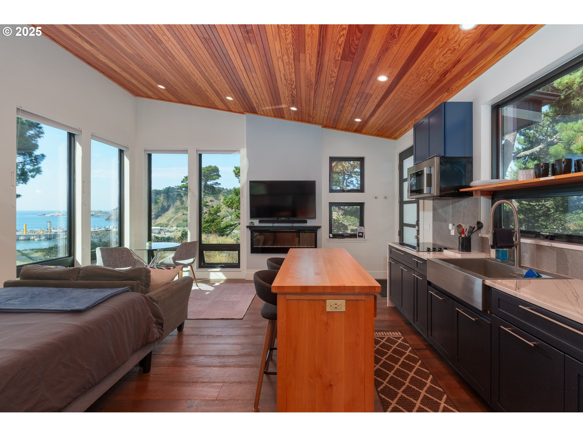 409 Jackson Street Port Orford, OR 97465 - Photo 40 of 48 a living room with furniture and a flat screen tv