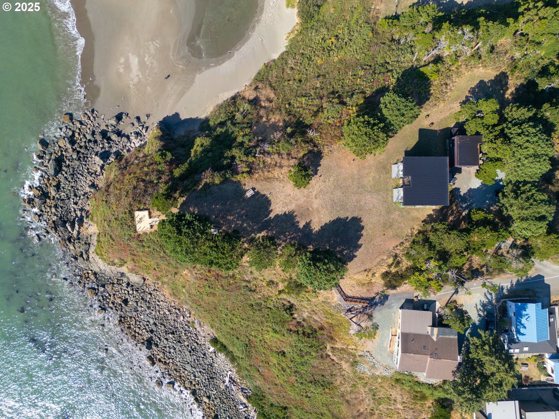 409 Jackson Street Port Orford, OR 97465 - Photo 4 of 48 an aerial view of a house with a yard
