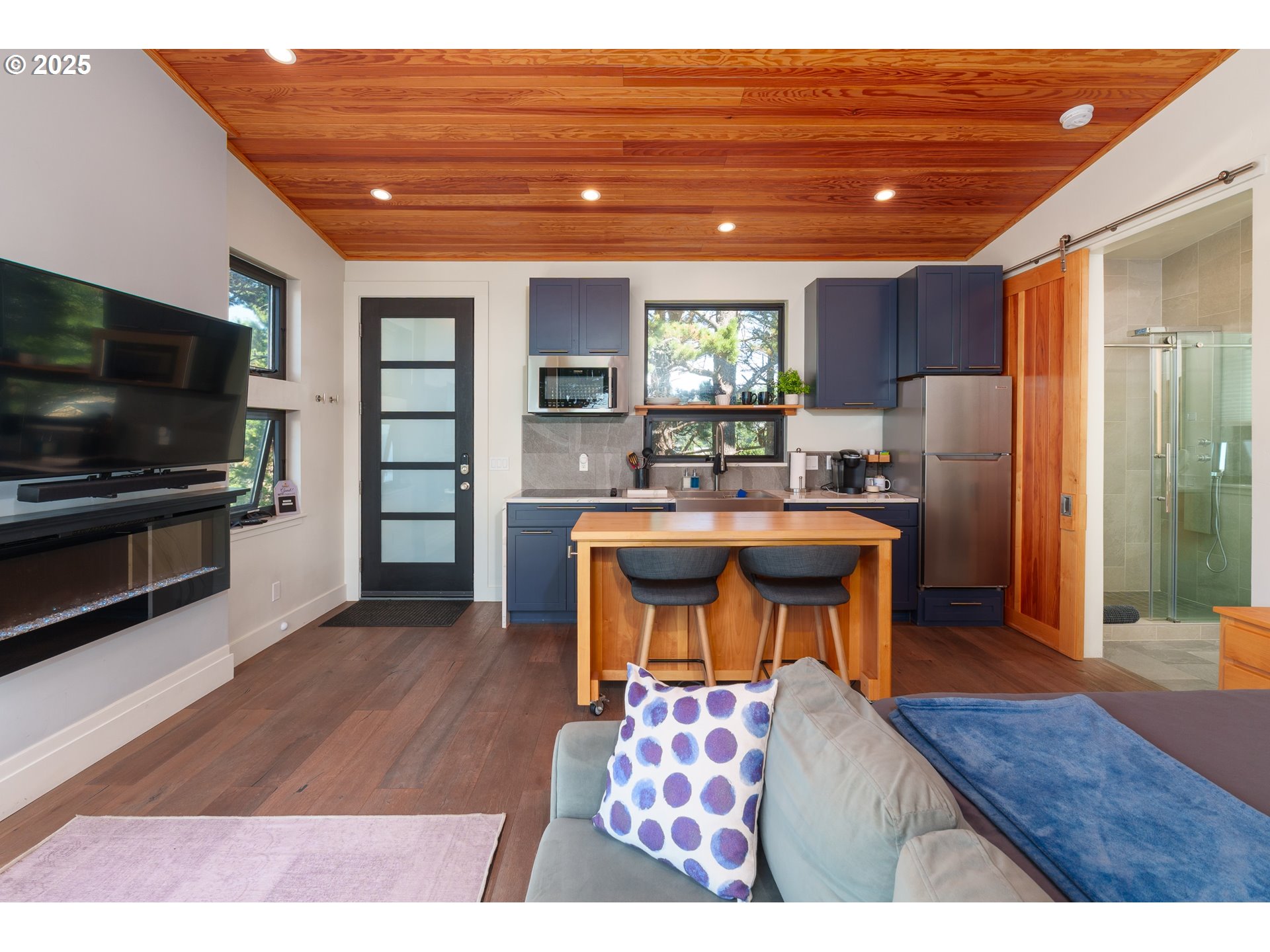 409 Jackson Street Port Orford, OR 97465 - Photo 42 of 48 a living room with furniture and a flat screen tv