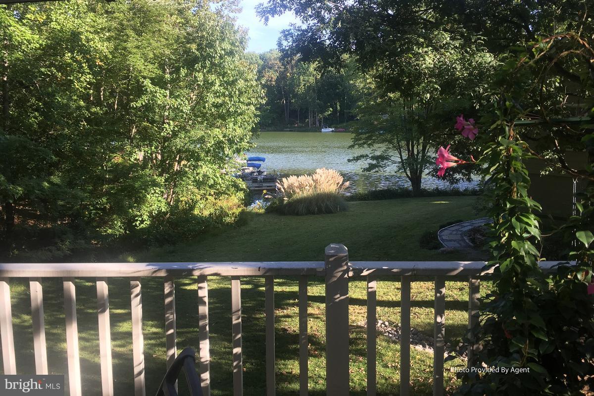 2225 Wakerobin Lane Reston, VA 20191 - Photo 14 of 30 a view of swimming pool from a lake