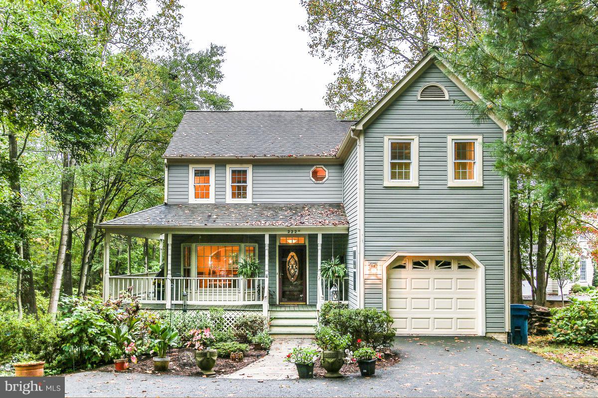 2225 Wakerobin Lane Reston, VA 20191 - Photo 3 of 30 a front view of a house with a yard and trees