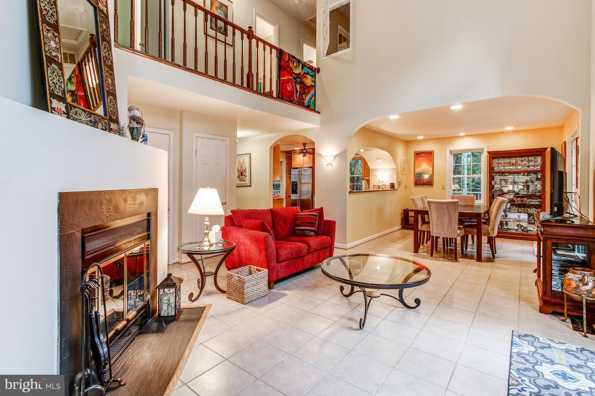 2225 Wakerobin Lane Reston, VA 20191 - Photo 10 of 30 a living room with furniture a window and chairs
