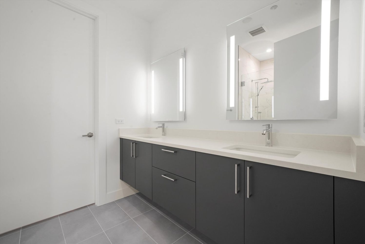 323 South Racine Avenue, Unit 3C Chicago, IL 60607 - Photo 11 of 18 a bathroom with a sink and a mirror