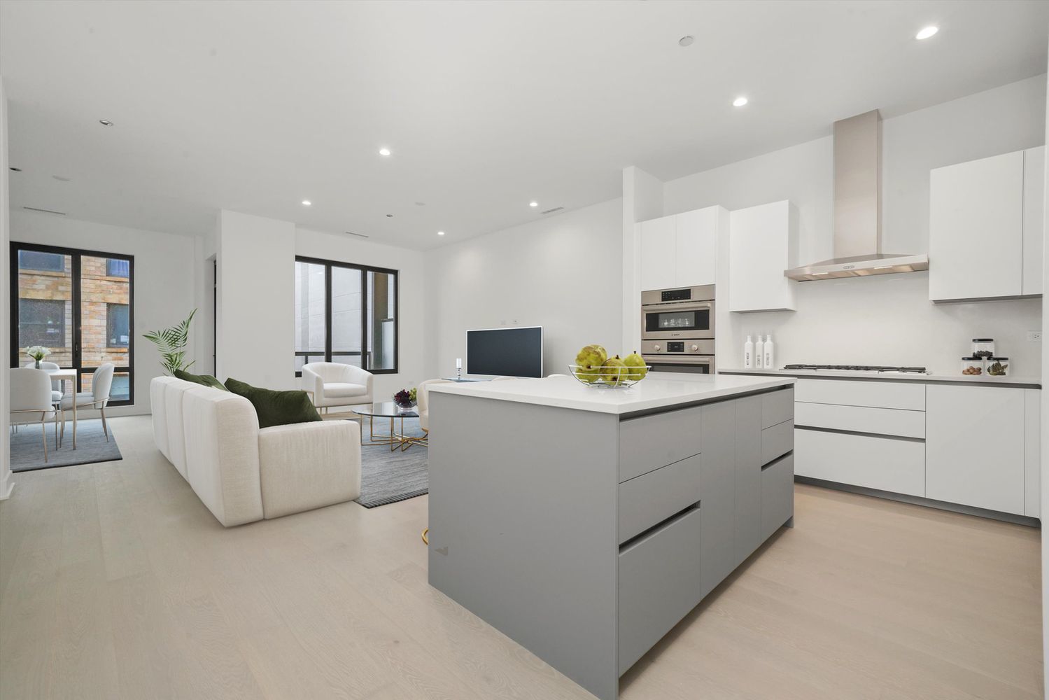 323 South Racine Avenue, Unit 3C Chicago, IL 60607 - Photo 3 of 18 a kitchen with white cabinets and white appliances
