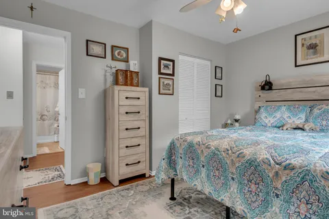 a bedroom with furniture and a stairs