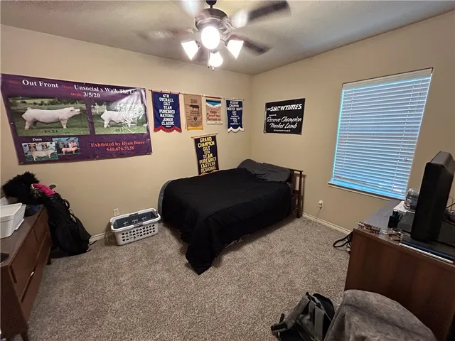 a bedroom with furniture and a bed