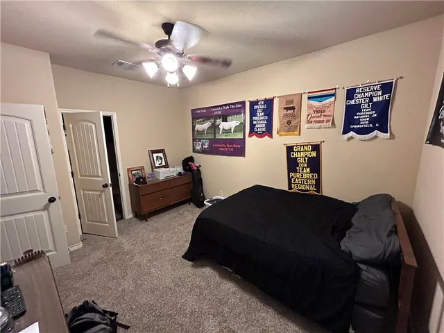 a living room with furniture and a mirror