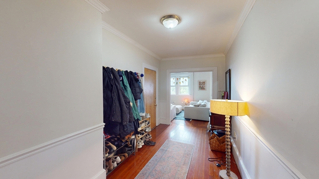 1213 Beacon Street, Unit 4 Brookline, MA 02446 - Photo 10 of 11 a view of a bedroom with furniture and a window