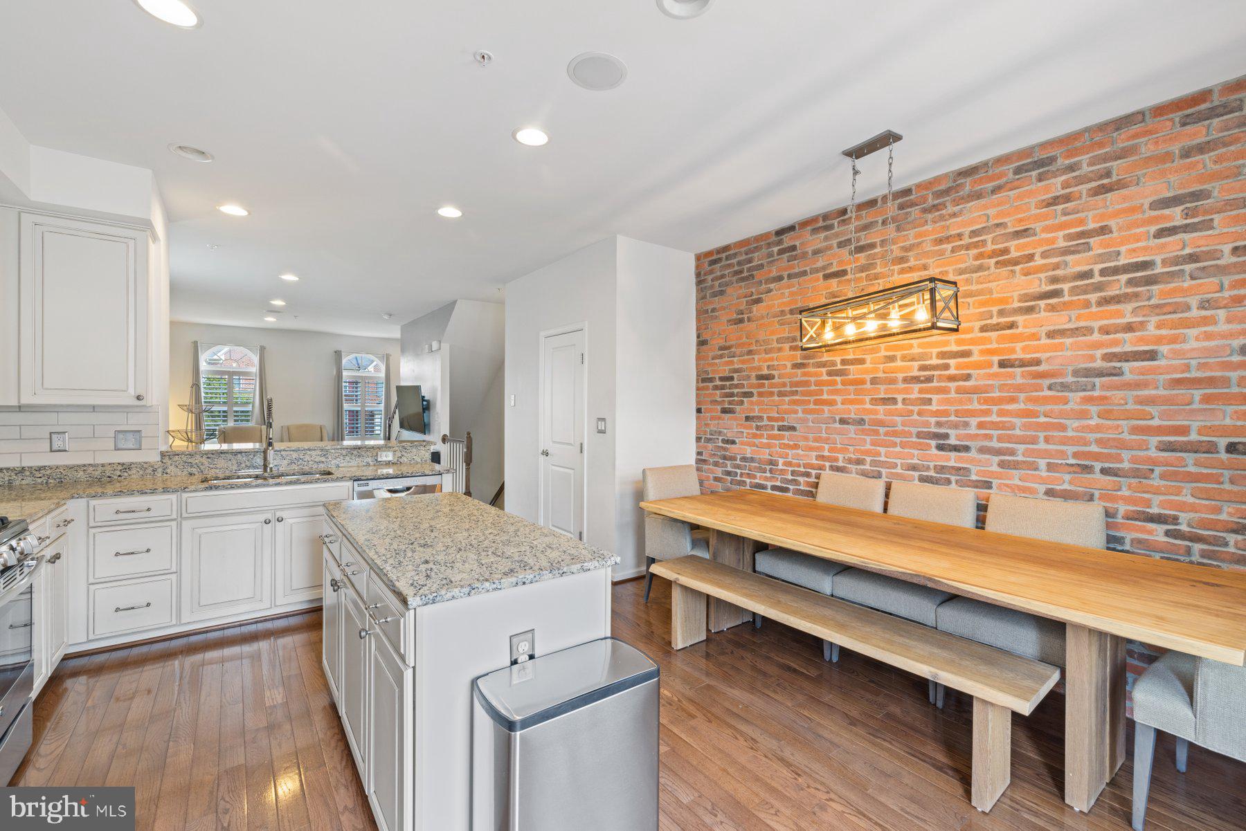 2514 Ralph Ellison Way Northeast Washington, DC 20018 - Photo 13 of 31 a kitchen with sink cabinets and wooden floor