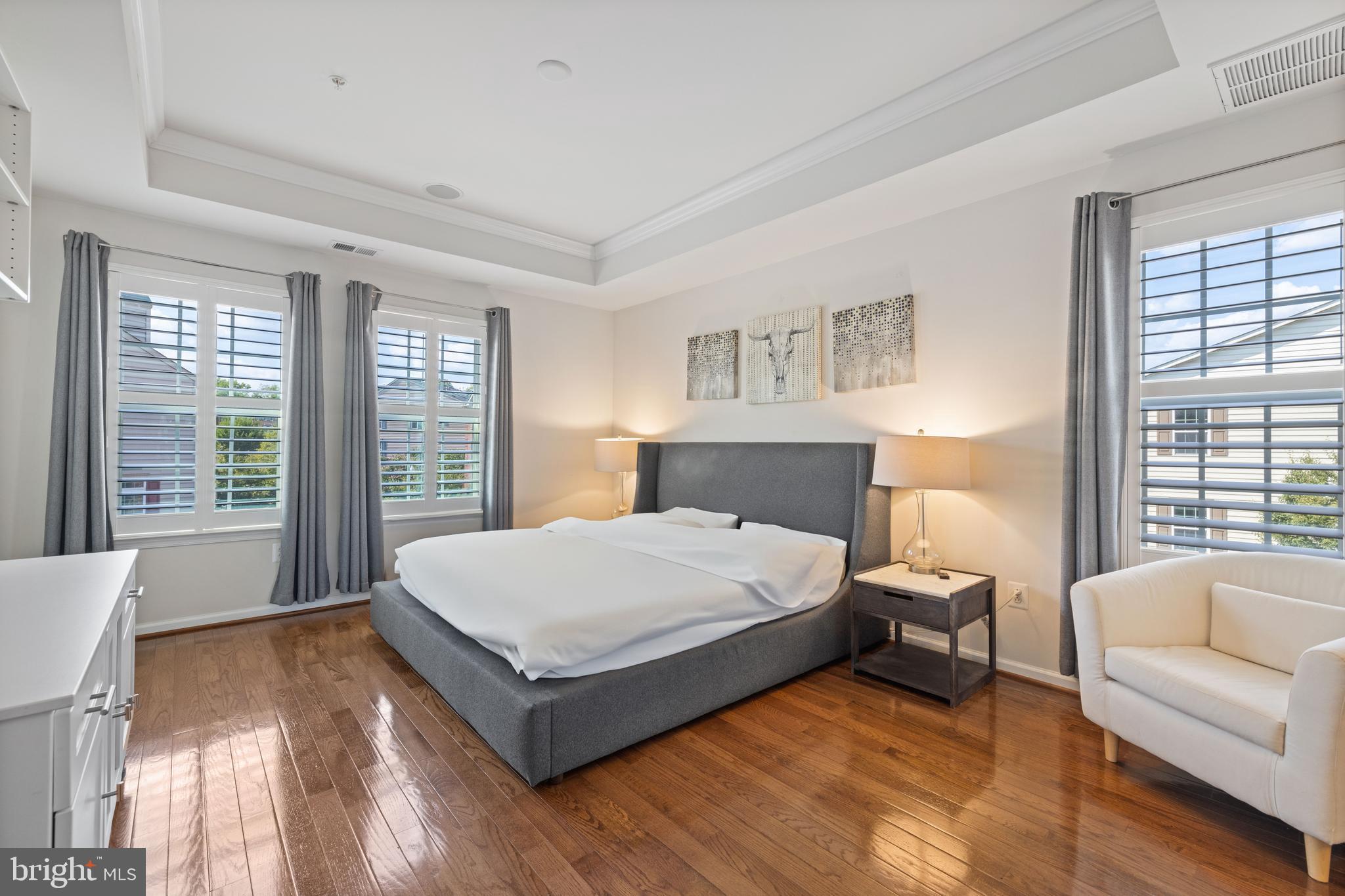 2514 Ralph Ellison Way Northeast Washington, DC 20018 - Photo 23 of 31 a spacious bedroom with a bed couch and a large window