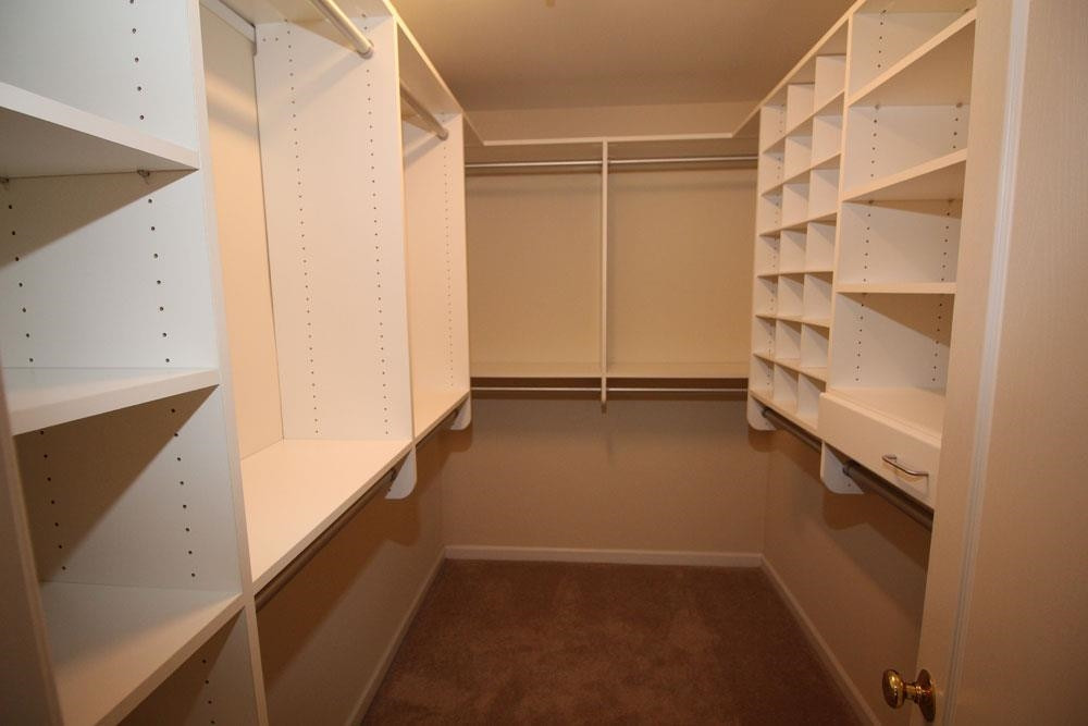 6952 Middleboro Drive Raleigh, NC 27612 - Photo 14 of 32 Master bedroom walk-in-closet with built-ins. Master Walk-in-Closet