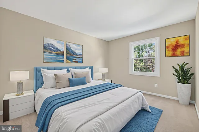 a bedroom with bed and a window