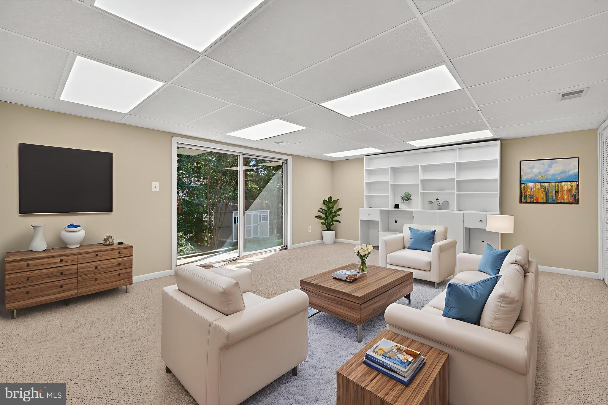 8537 Hooes Road Springfield, VA 22153 - Photo 20 of 30 a living room with furniture and a flat screen tv