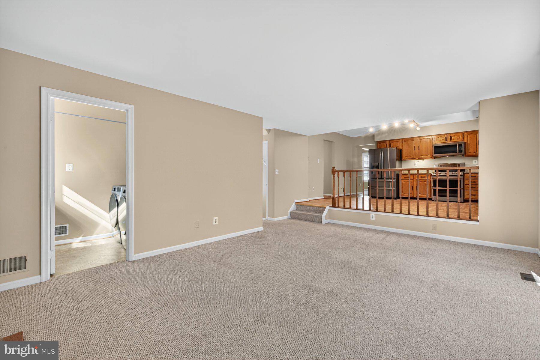 8537 Hooes Road Springfield, VA 22153 - Photo 7 of 30 a view of a livingroom with furniture and an entryway