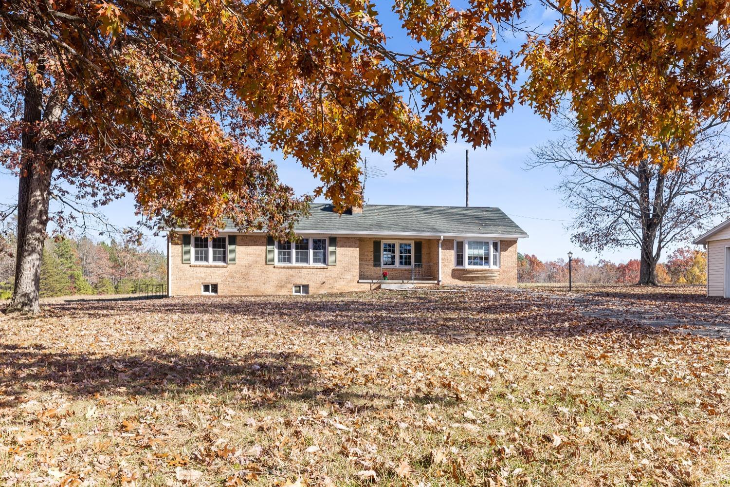 10572 Red House Road Red House, VA 23963 - Photo 2 of 21 a front view of a house with a garden