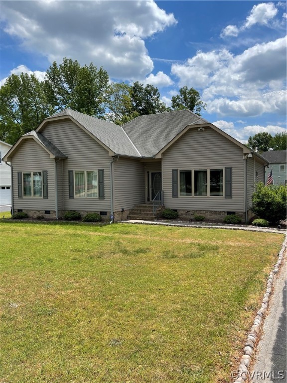 5413 Gatebridge Road Richmond, VA 23234 - Photo 14 of 16 a front view of a house with a garden