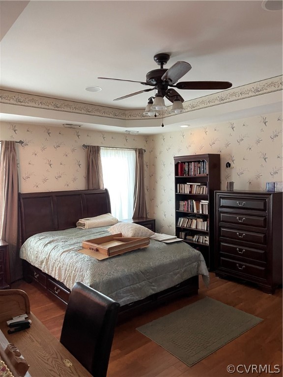 5413 Gatebridge Road Richmond, VA 23234 - Photo 8 of 16 a bedroom with a bed a dresser and a book shelf