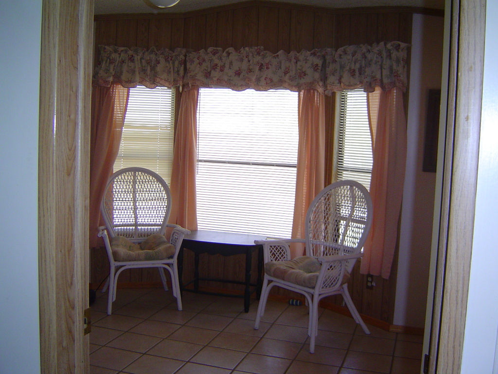 108 North Tomahawk Road Apache Junction, AZ 85119 - Photo 7 of 9 a dining room with furniture and window