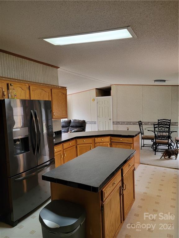 3014 Anderson Road South Catawba, SC 29704 - Photo 6 of 21 a kitchen with stainless steel appliances granite countertop a sink a refrigerator and a stove