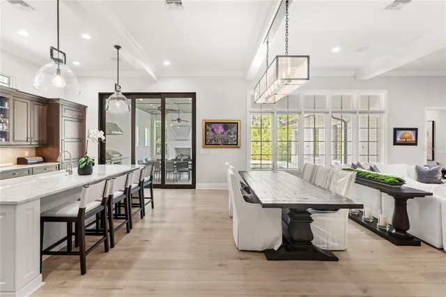 a view of a dining room with furniture window and outside view