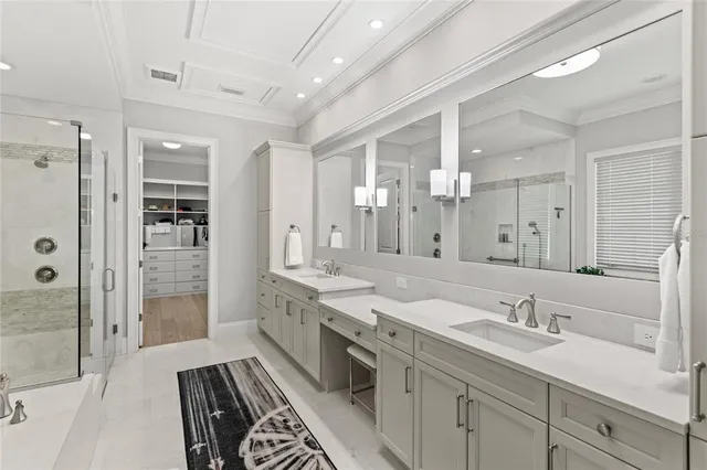 a spacious bathroom with a double vanity sink mirror double and shower