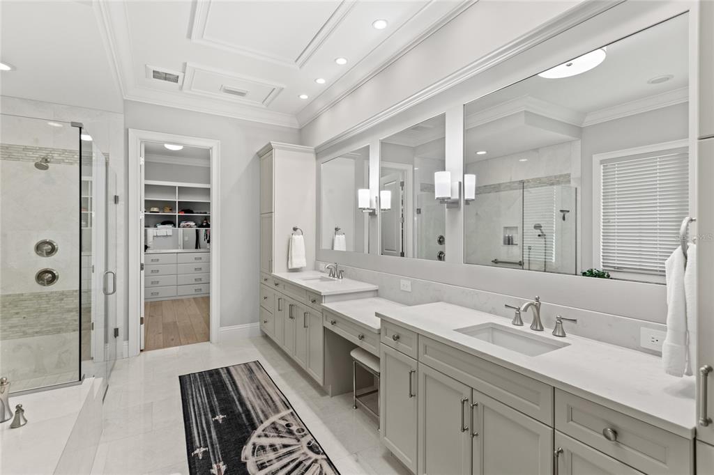 10224 Mattraw Place Orlando, FL 32836 - Photo 17 of 43 a spacious bathroom with a double vanity sink mirror double and shower