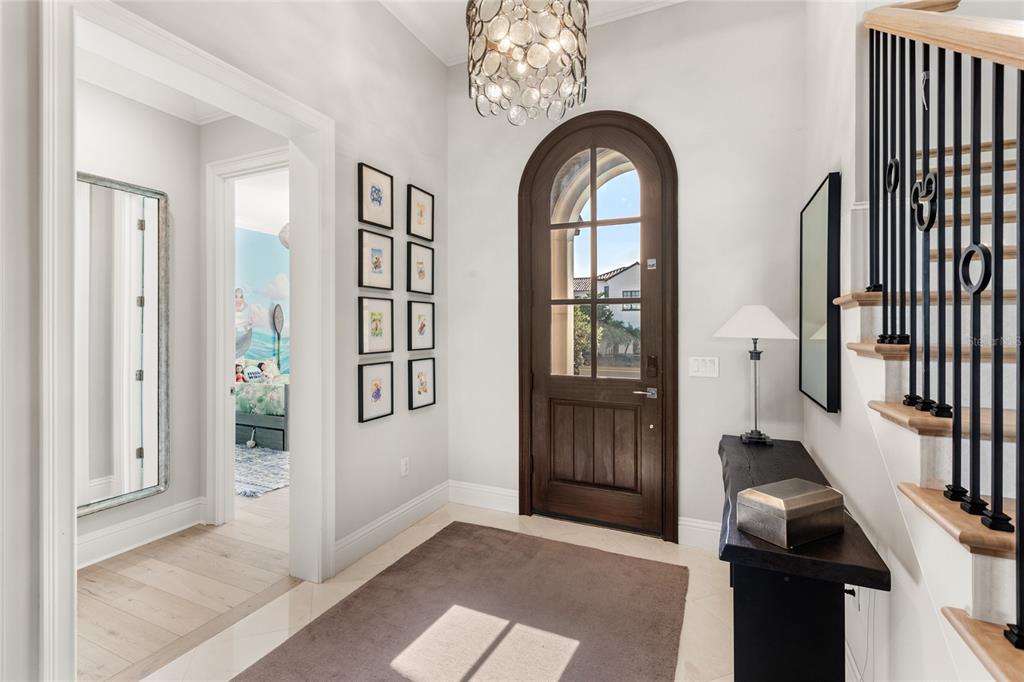 10224 Mattraw Place Orlando, FL 32836 - Photo 2 of 43 a view of entryway with wooden floor