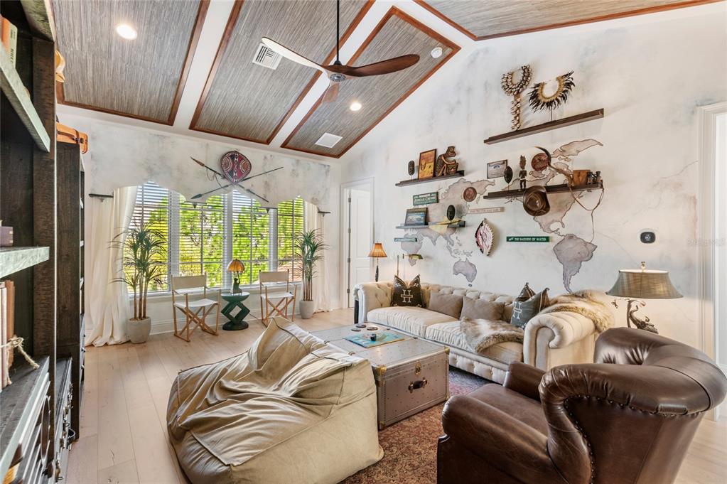 10224 Mattraw Place Orlando, FL 32836 - Photo 22 of 43 a living room with furniture fireplace and large windows