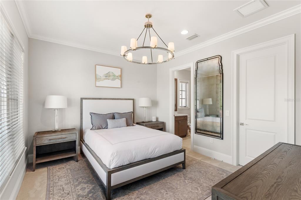 10224 Mattraw Place Orlando, FL 32836 - Photo 25 of 43 a bedroom with a bed and window