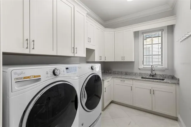 a view of a kitchen with washer and dryer