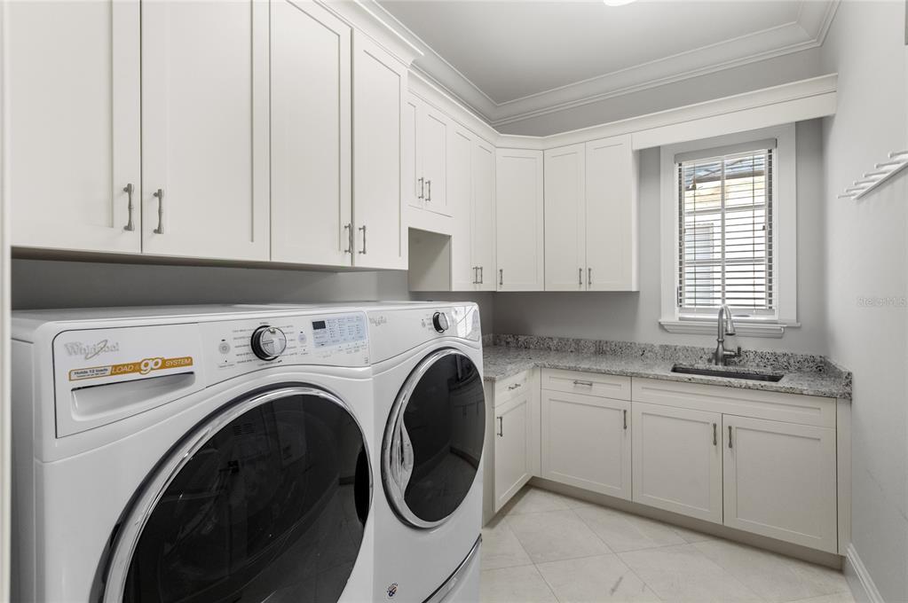 10224 Mattraw Place Orlando, FL 32836 - Photo 32 of 43 a view of a kitchen with washer and dryer