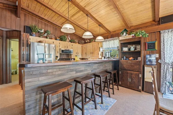 a kitchen with a table and chairs in it