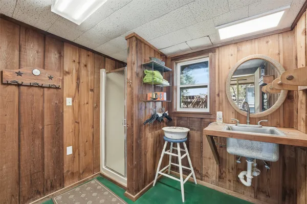 a room with furniture a mirror and a window