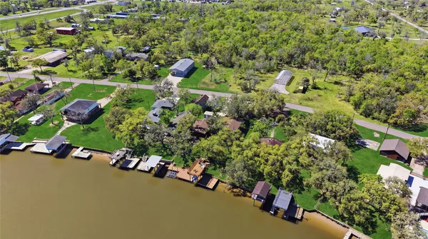 an aerial view of a golf course with parking space
