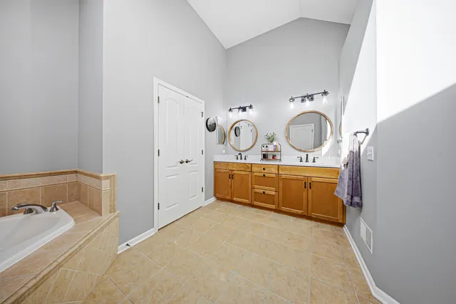 a bathroom with a tub and shower