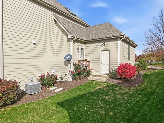 a view of a roof deck with table and chairs a barbeque with wooden floor and fence
