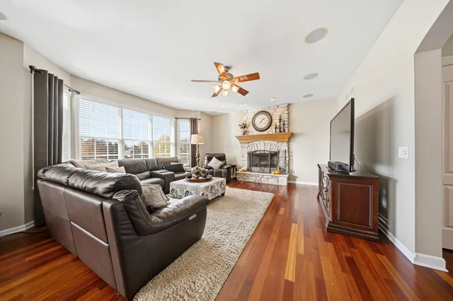 a living room with furniture fireplace and a flat screen tv