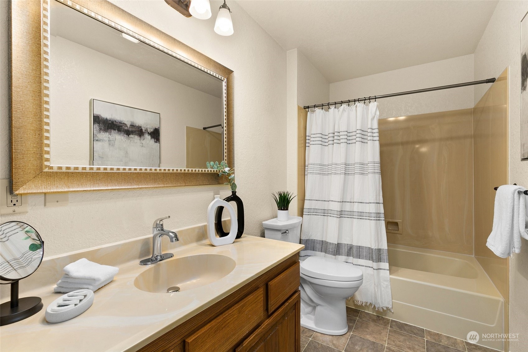 13626 Northeast 7th Street, Unit F16 Bellevue, WA 98005 - Photo 12 of 22 a bathroom with a toilet sink and shower