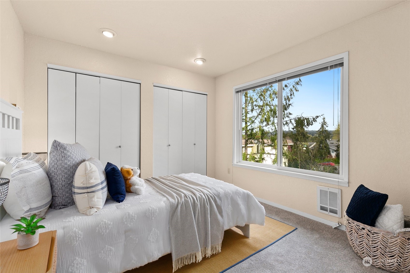 13626 Northeast 7th Street, Unit F16 Bellevue, WA 98005 - Photo 13 of 22 a bedroom with a bed and window