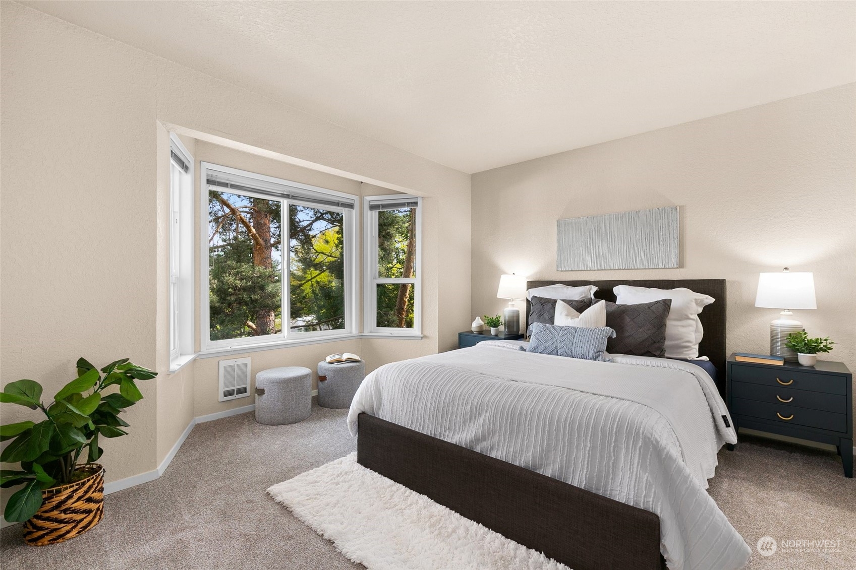 13626 Northeast 7th Street, Unit F16 Bellevue, WA 98005 - Photo 14 of 22 a bedroom with a large bed and a large window