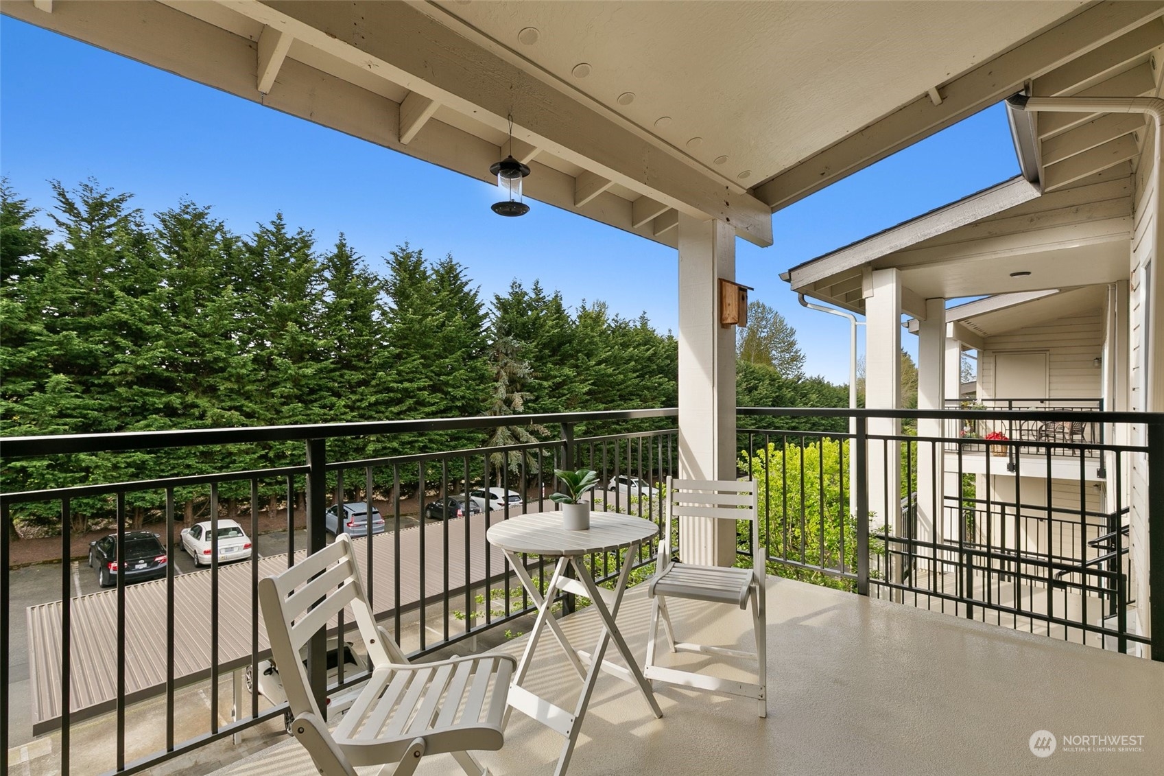 13626 Northeast 7th Street, Unit F16 Bellevue, WA 98005 - Photo 19 of 22 a view of a chairs and table in the balcony