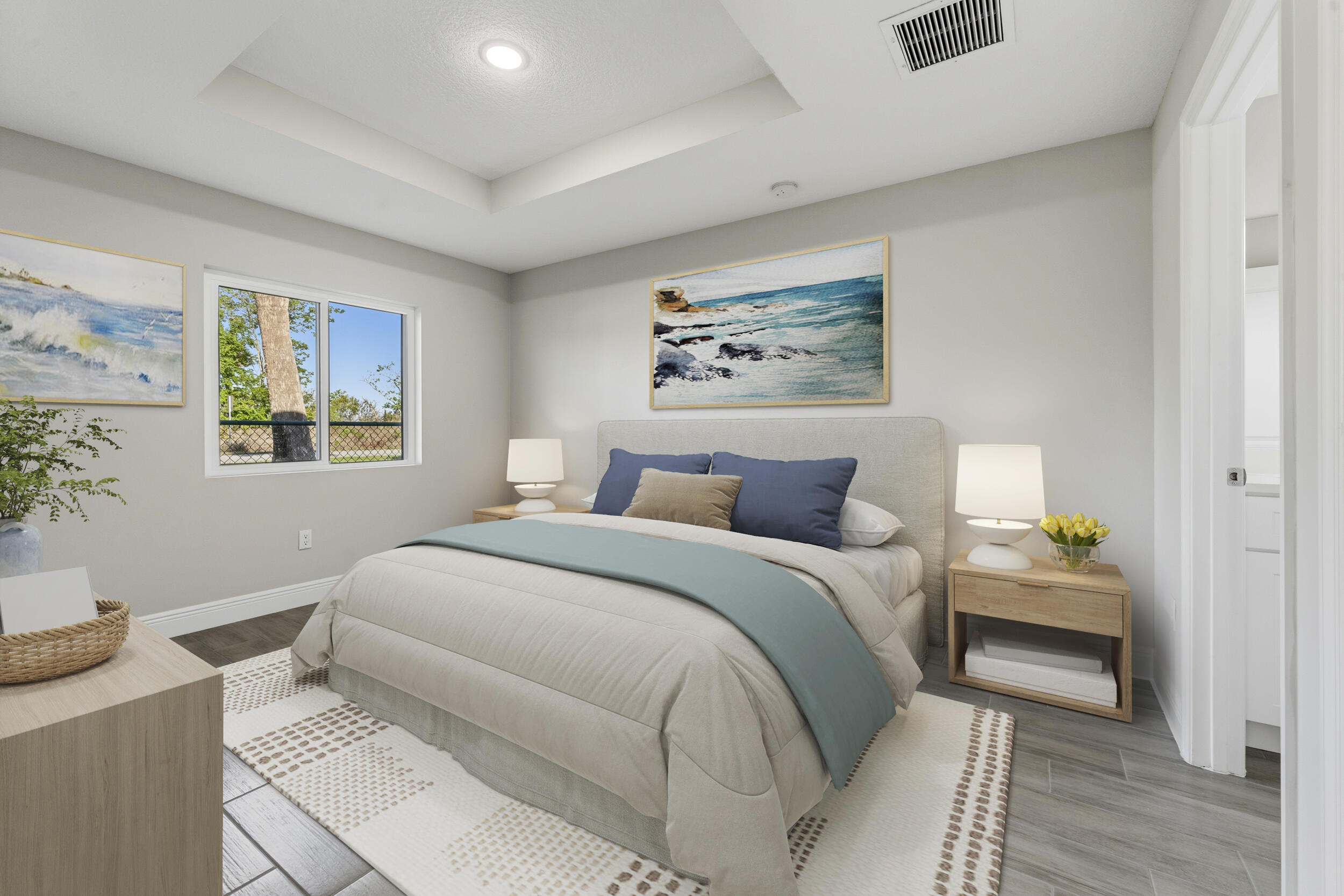 4335 Southwest 15th Way Okeechobee, FL 34974 - Photo 15 of 33 a spacious bedroom with a bed and a painting on the wall