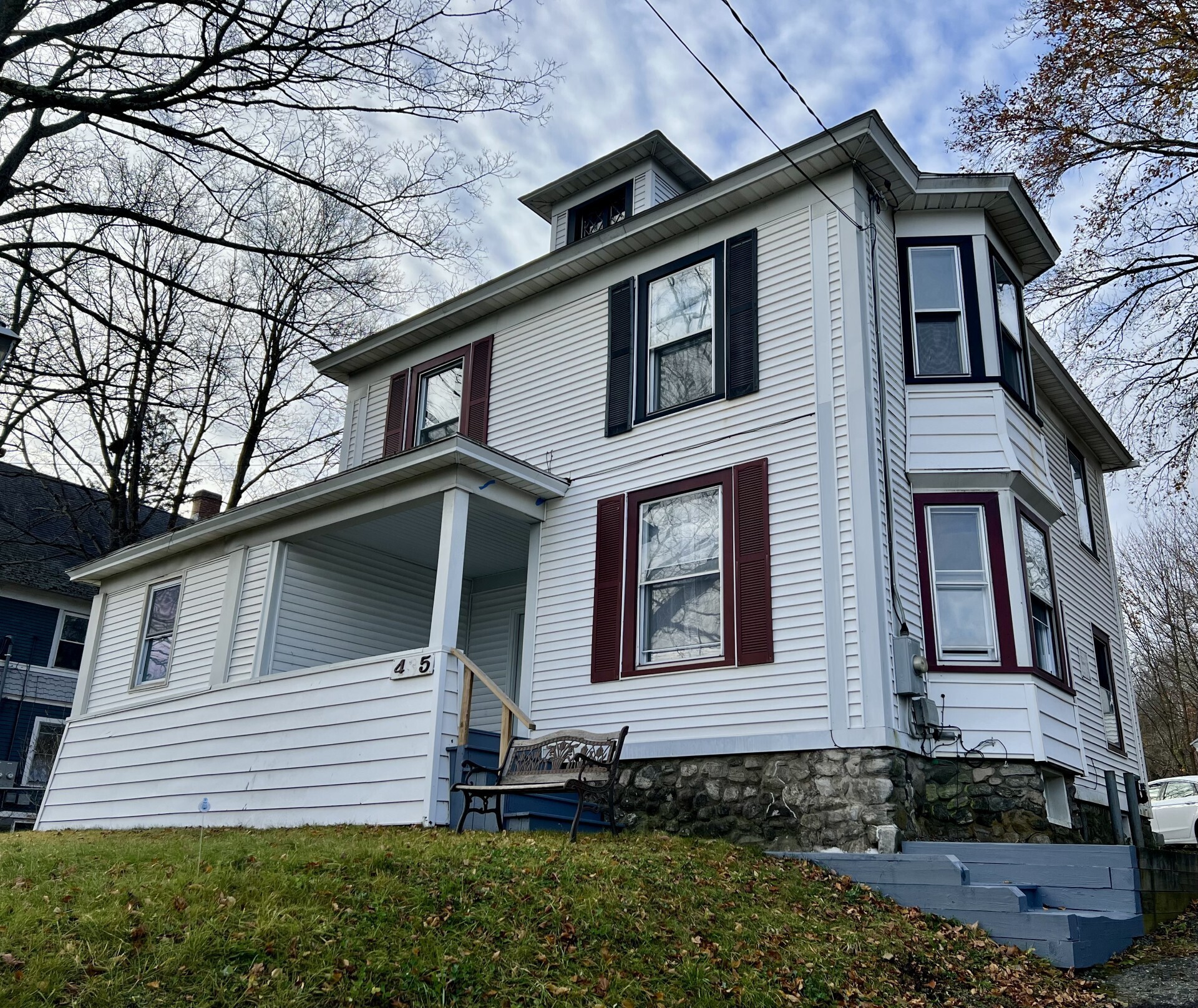 a front view of a house with a yard