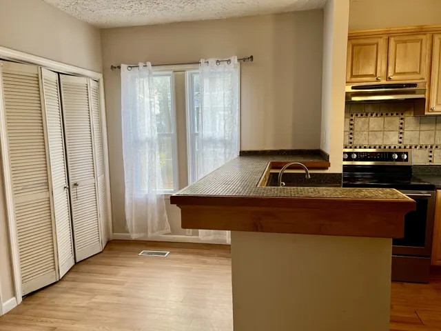 a room with a sink and a window