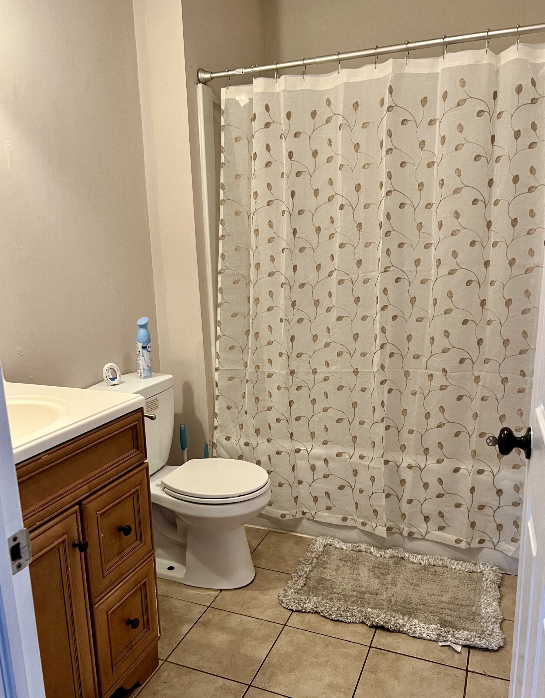 435 Windham Road Windham, CT 06226 - Photo 15 of 20 a white toilet sitting next to a shower curtain