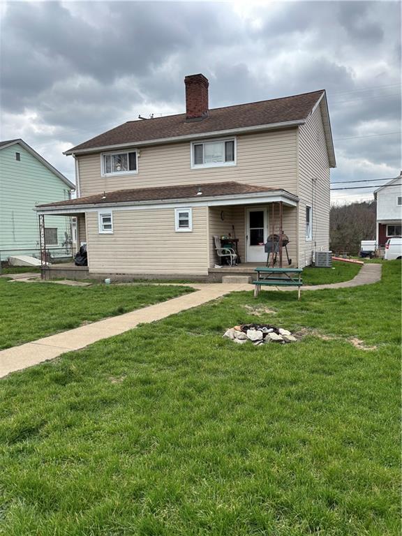 421-423 Georgetown Road Lawrence, PA 15055 - Photo 2 of 27 a front view of a house with a yard and garage