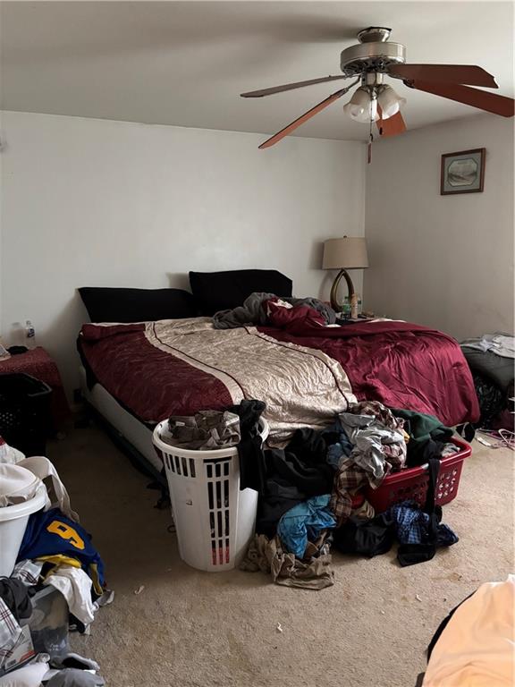 421-423 Georgetown Road Lawrence, PA 15055 - Photo 23 of 27 a bedroom with bed and a chandelier
